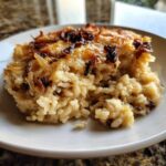 A close-up serving of creamy french onion butter rice topped with caramelized onions.