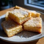 Close-up of square Gluten-Free Lemon Thyme Shortbread Cookies topped with coarse sugar.